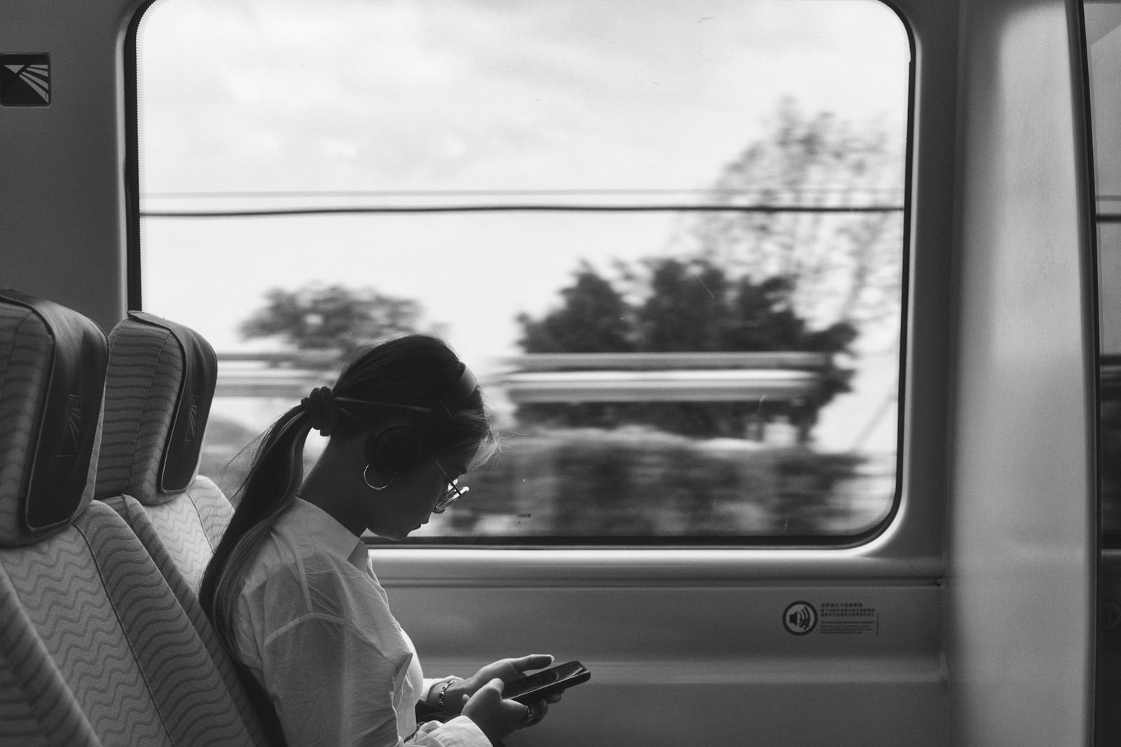 Passenger using a phone on a China Railway high-speed train